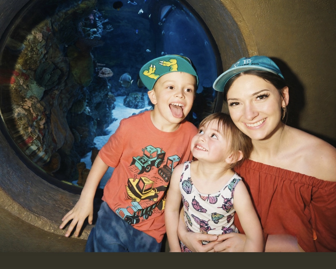 Anna Marie enjoying an aquarium visit with her children