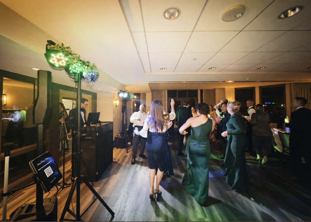 Wedding dance floor with DJ-style lighting and dancing guests